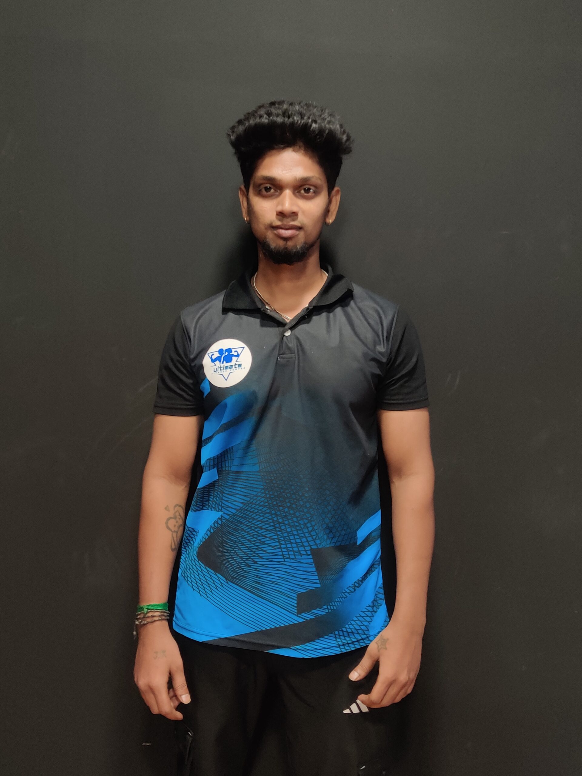 Professional fitness trainer at Ultimate Fitness Centre, Adyar, guiding members with customized workout plans